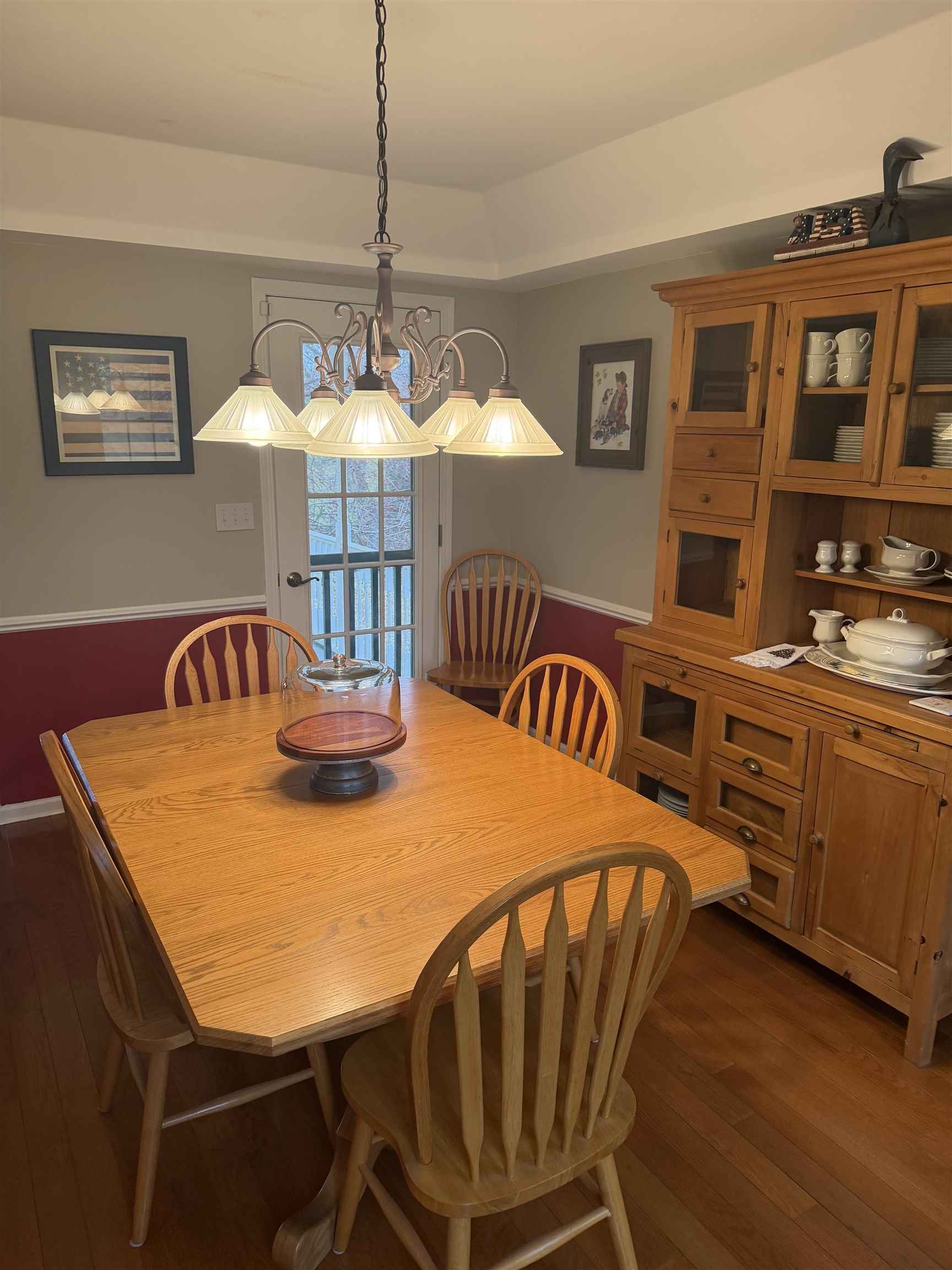 5206 East Hubbard Trail Byron, IL 61010 - Photo 19 of 52 a view of a dining room with furniture and chandelier