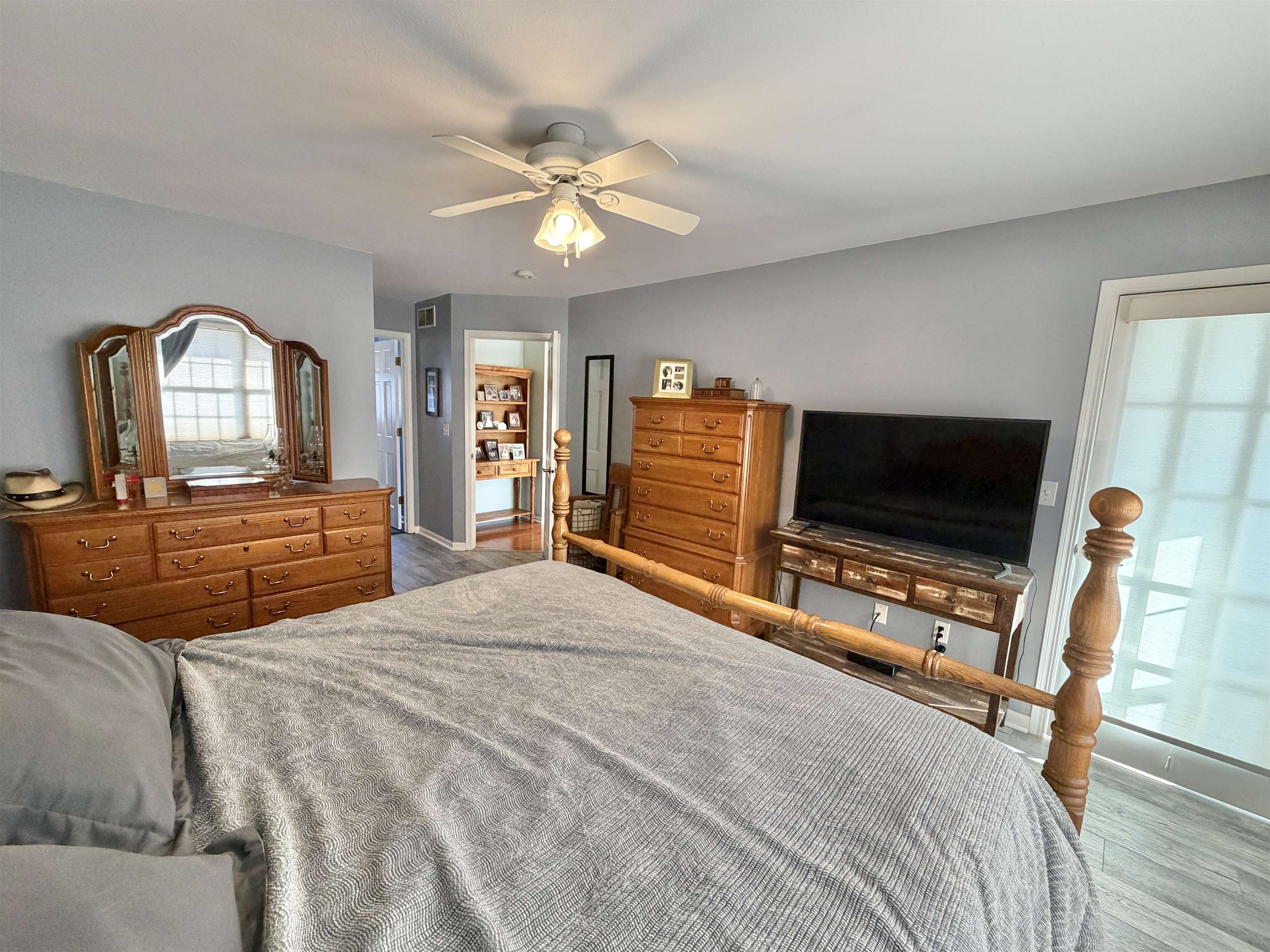 5206 East Hubbard Trail Byron, IL 61010 - Photo 34 of 52 a bedroom with furniture and a flat screen tv