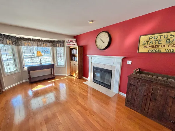 a living room with furniture a table and a large window