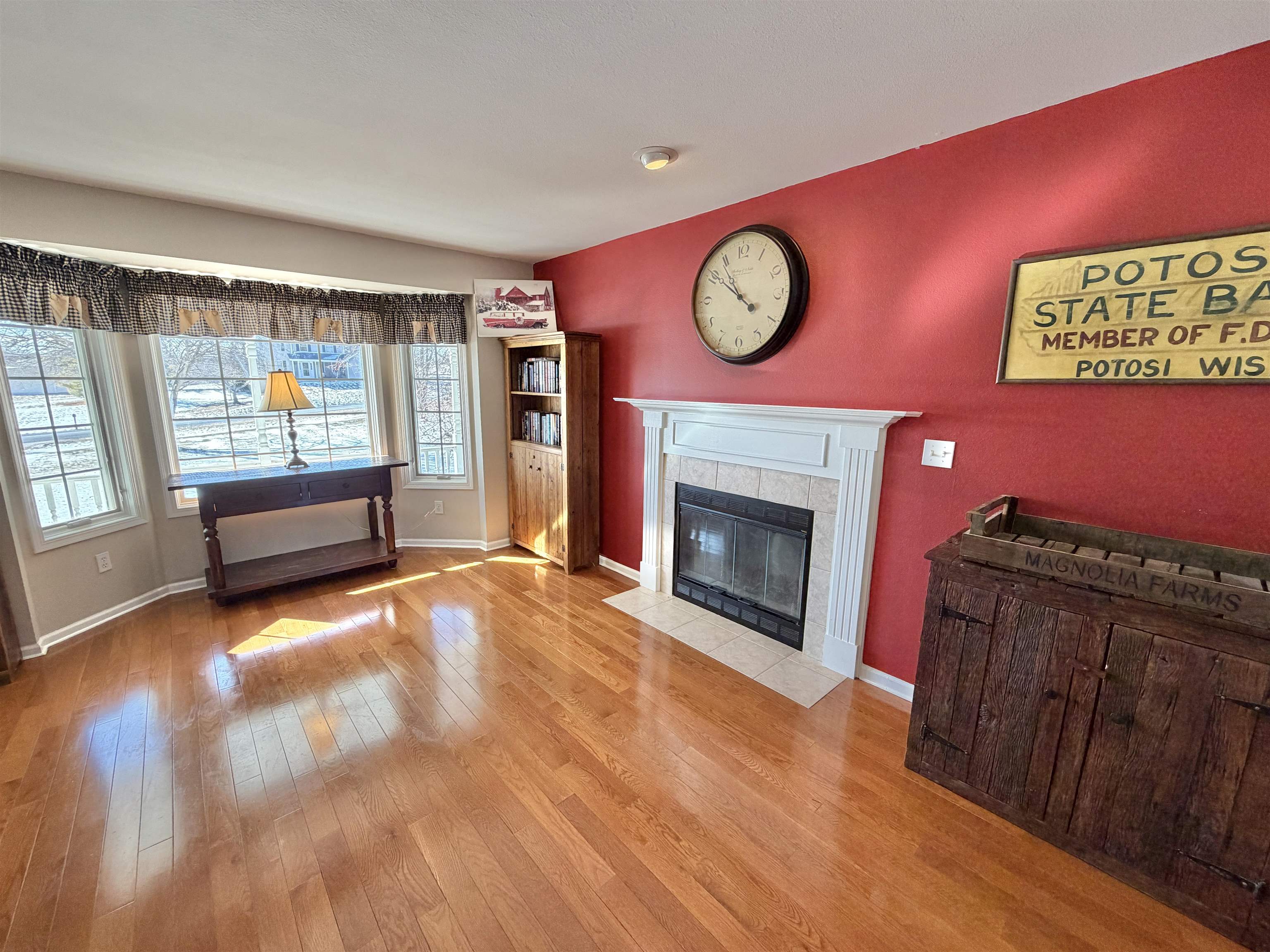 5206 East Hubbard Trail Byron, IL 61010 - Photo 6 of 52 a view of an empty room with a fireplace and a window