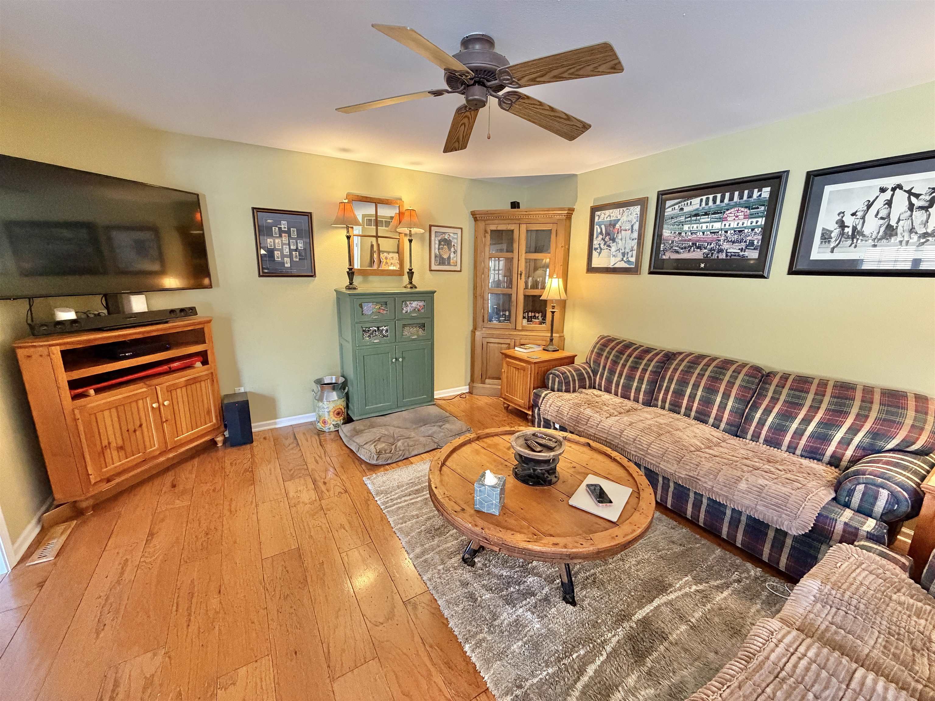 5206 East Hubbard Trail Byron, IL 61010 - Photo 7 of 52 a living room with furniture and a flat screen tv