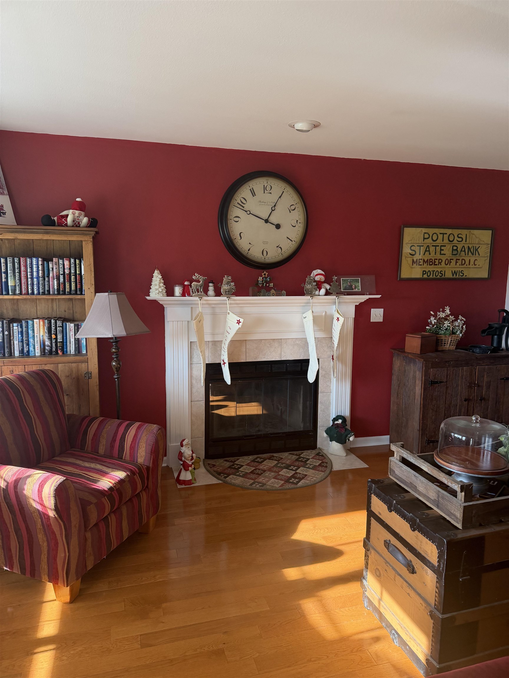 5206 East Hubbard Trail Byron, IL 61010 - Photo 8 of 52 a living room with furniture a flat screen tv and a fireplace