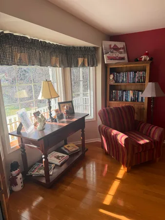 a view of a dining room with furniture and chandelier