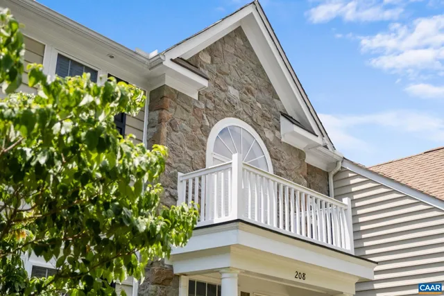 a view of a house with a flower garden