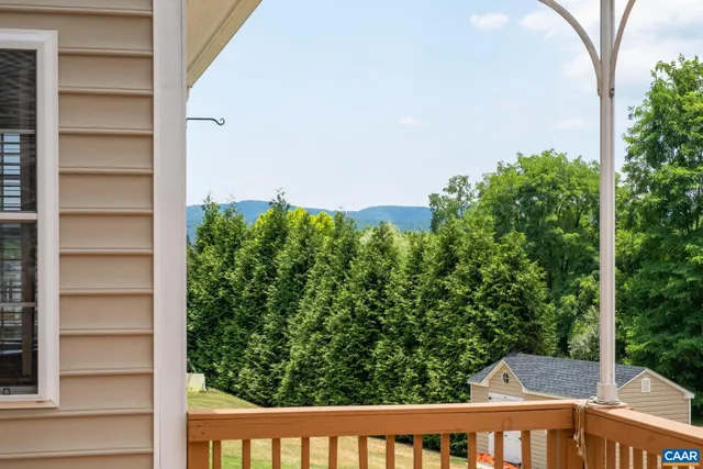 a view of house with garage and yard