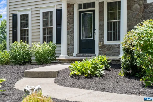 a view of a house with potted plants and a potted plant