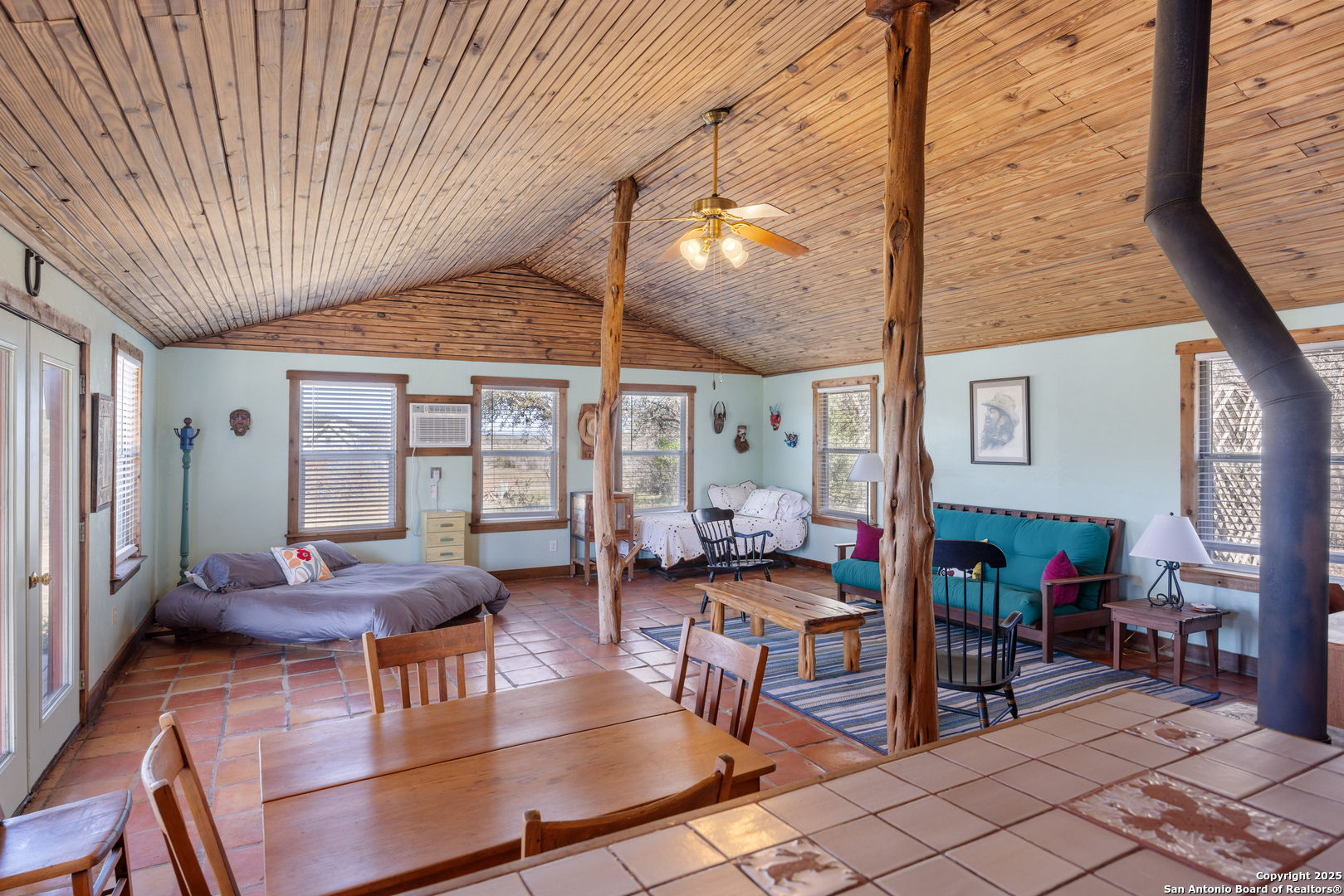 2925 County Road 361 Utopia, TX 78884 - Photo 13 of 35 a living room with furniture a rug and a table