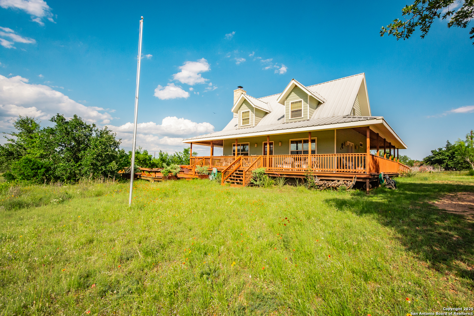2925 County Road 361 Utopia, TX 78884 - Photo 20 of 35 a view of an house with backyard space and balcony