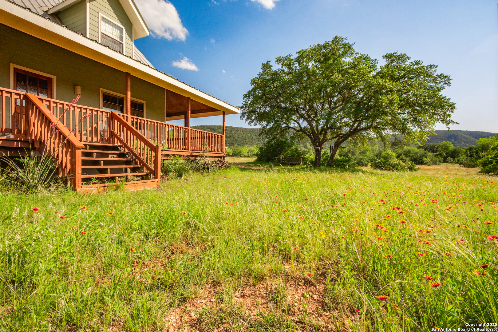 2925 County Road 361 Utopia, TX 78884 - Photo 21 of 35 a view of a house with a yard