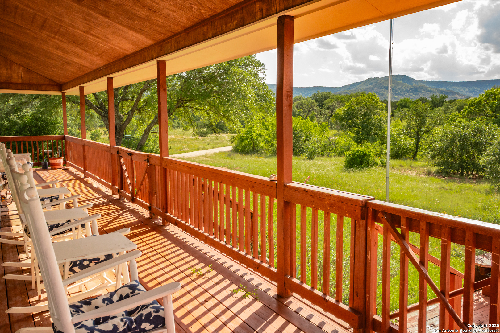 2925 County Road 361 Utopia, TX 78884 - Photo 22 of 35 a view of balcony with wooden floor