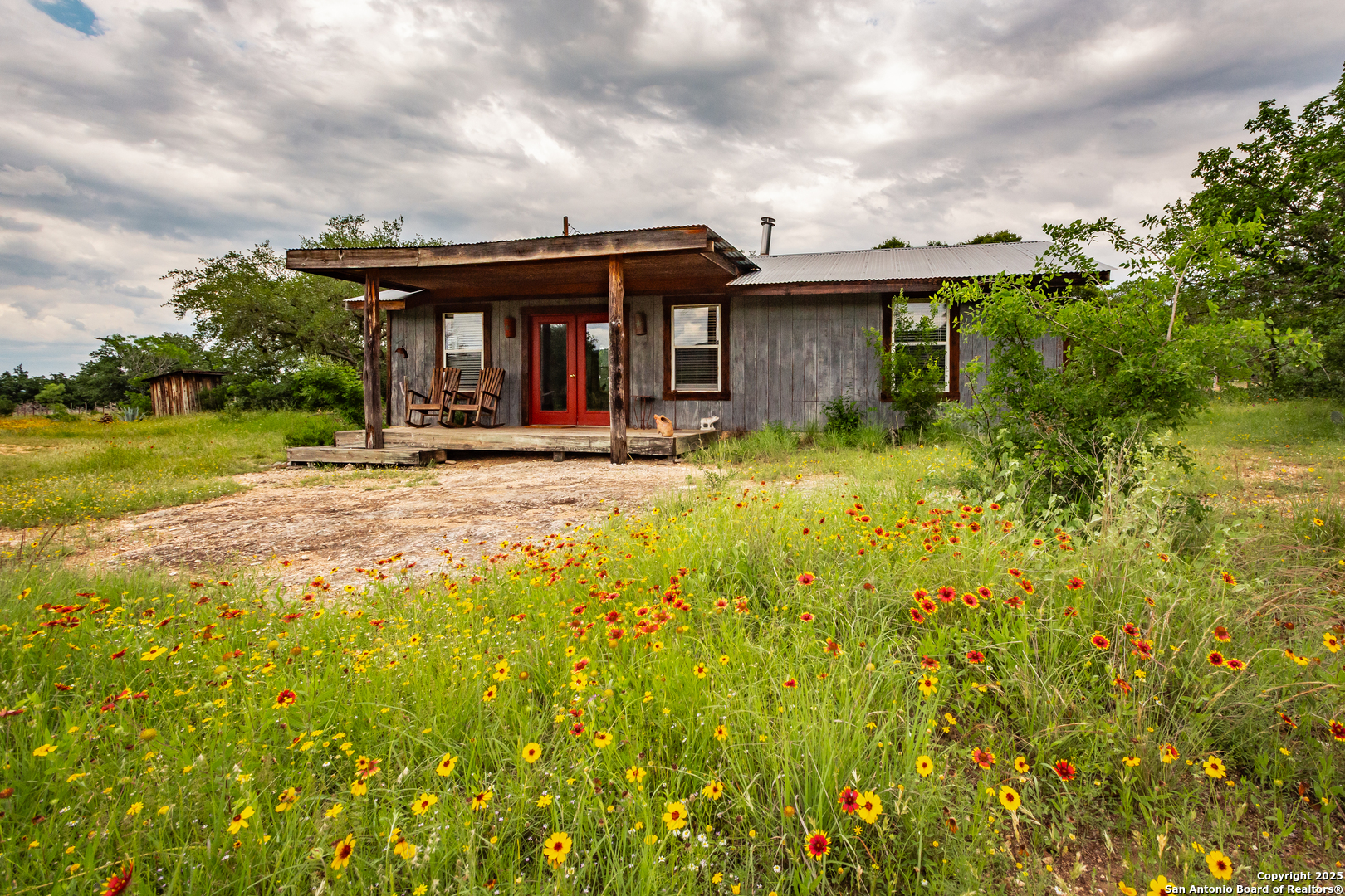 2925 County Road 361 Utopia, TX 78884 - Photo 28 of 35 a view of a house with pool and sitting area