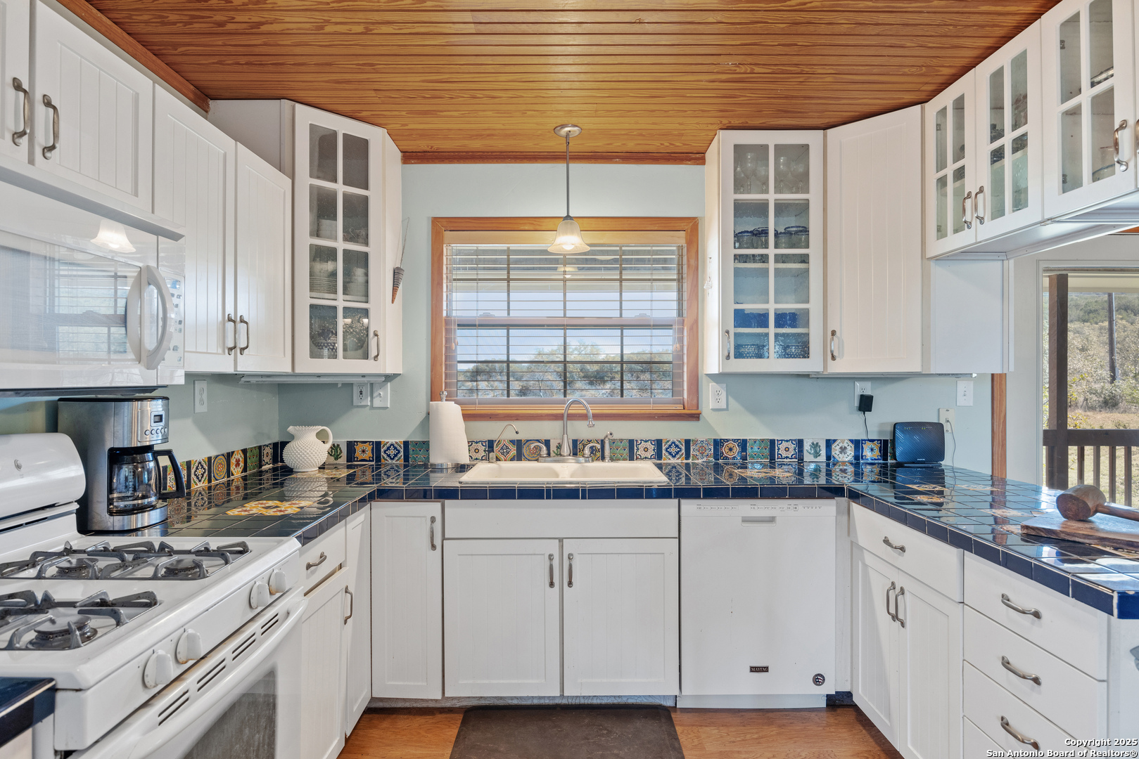 2925 County Road 361 Utopia, TX 78884 - Photo 4 of 35 a kitchen with stainless steel appliances granite countertop a sink a stove and cabinets