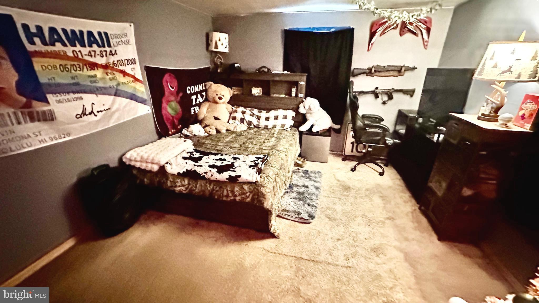 69 High Street Leesburg, NJ 08327 - Photo 24 of 34 a bed room with furniture window and a flat screen tv