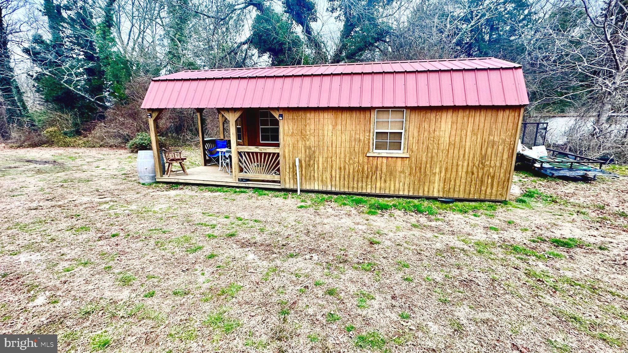 69 High Street Leesburg, NJ 08327 - Photo 28 of 34 a view of a house with a yard and wooden fence