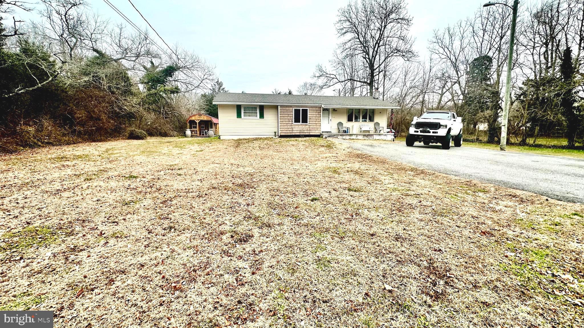 69 High Street Leesburg, NJ 08327 - Photo 6 of 34 a car parked in front of house