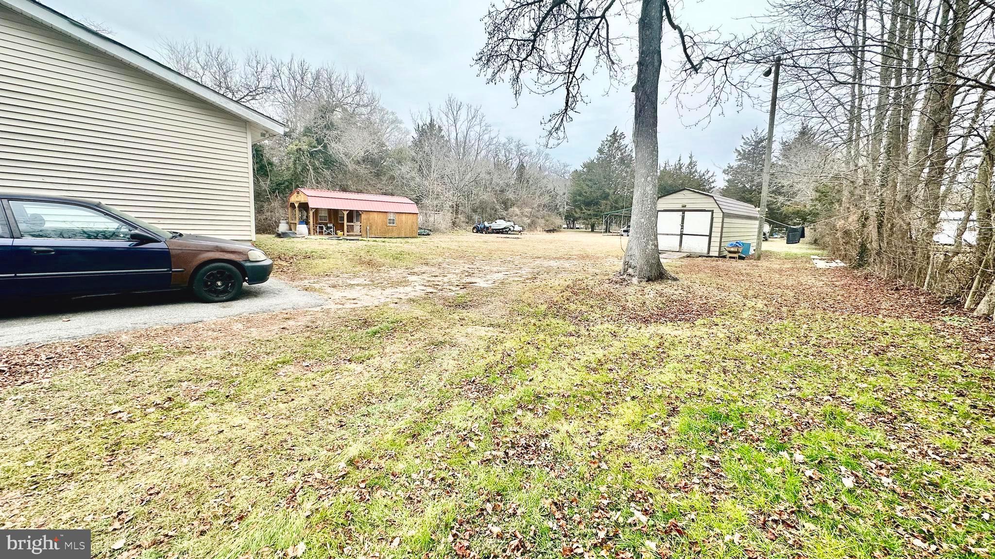 69 High Street Leesburg, NJ 08327 - Photo 9 of 34 a view of a house with a yard covered in snow
