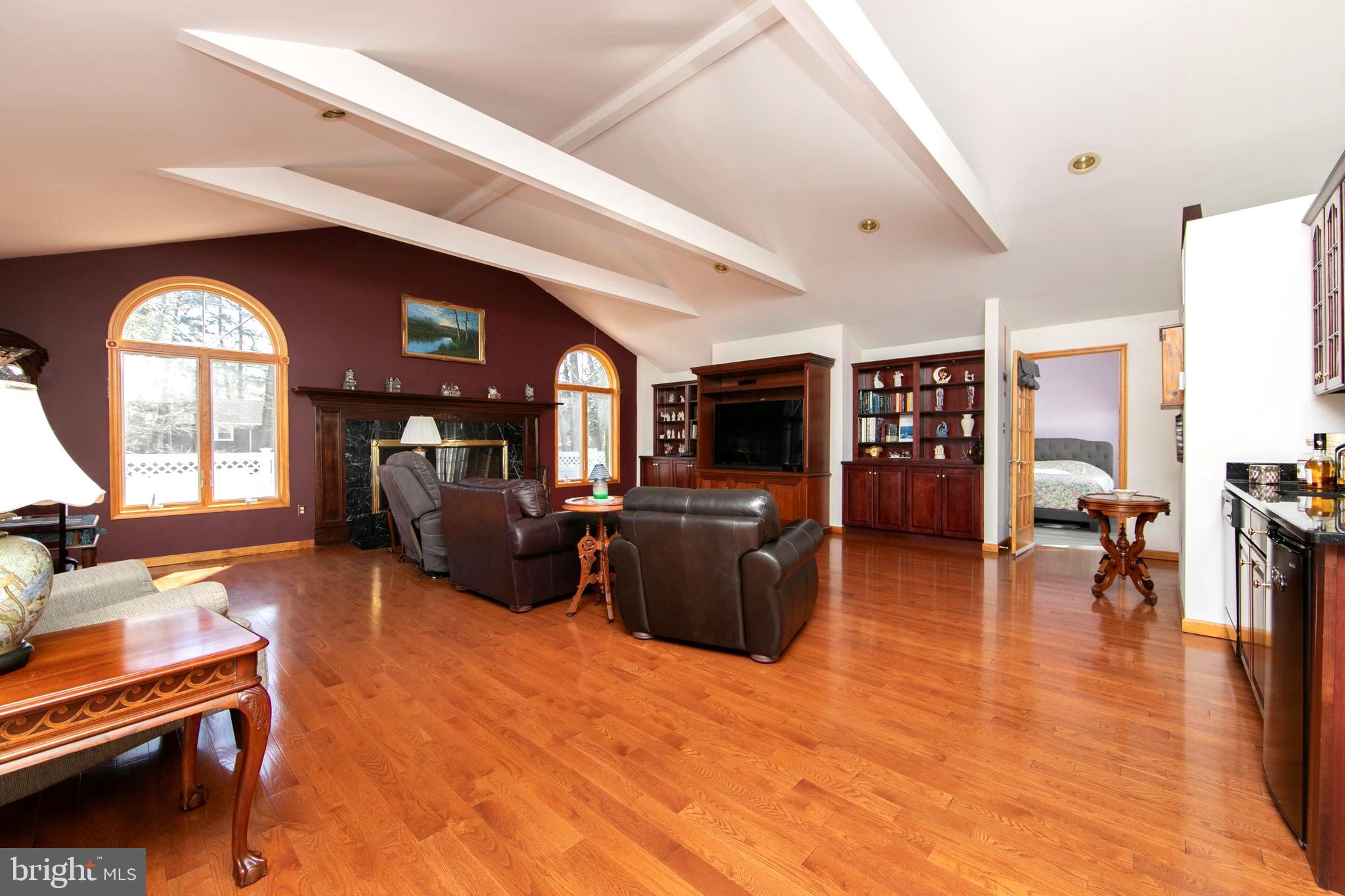 21 Golf Drive Hammonton, NJ 08037 - Photo 11 of 54 Great room with hardwood flooring and fireplace