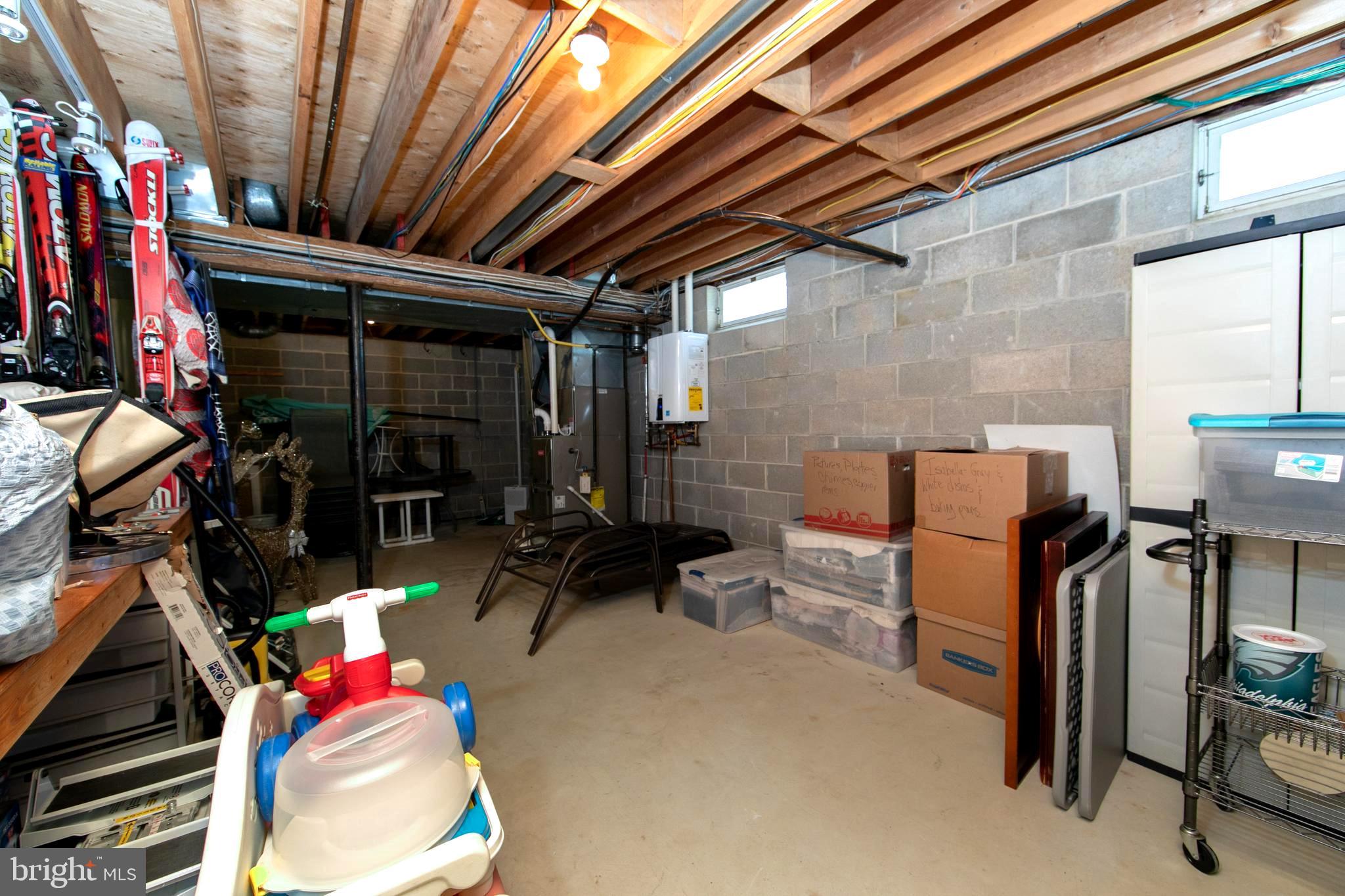 21 Golf Drive Hammonton, NJ 08037 - Photo 43 of 54 Utility area Bilco door & tankless water heater