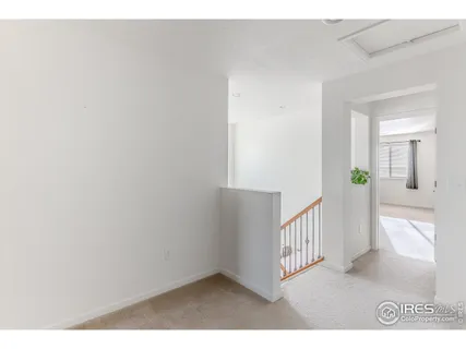 a bedroom with a bed and a night stand