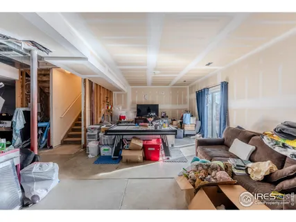 a view of a balcony with wooden chairs