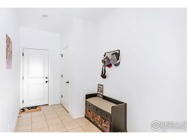 a room with a door and a white cabinet