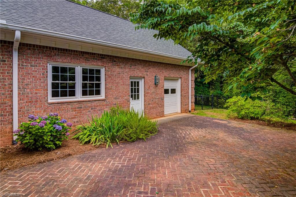 1531 Carters Grove Road Clemmons, NC 27012 - Photo 32 of 35 Back entrance to 3rd garage bay off patio