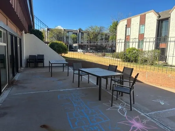 a view of a chairs and tables in the patio