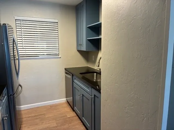 a kitchen with a stove and a refrigerator
