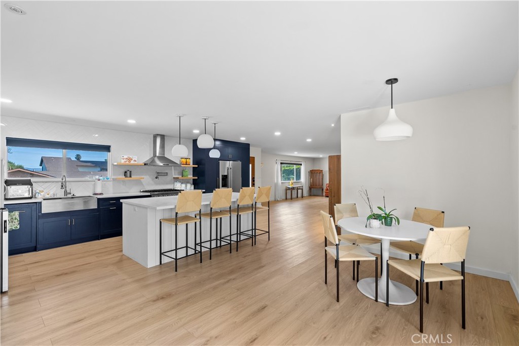 6 Santa Clara Drive Lompoc, CA 93436 - Photo 13 of 40 a kitchen with kitchen island wooden floor and chairs