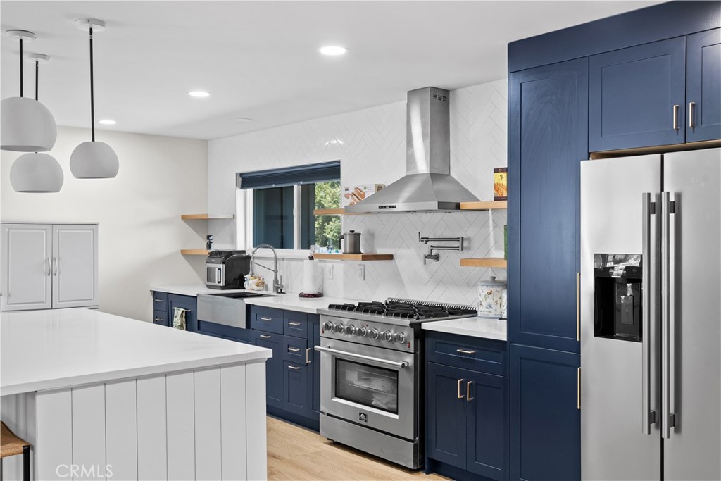 6 Santa Clara Drive Lompoc, CA 93436 - Photo 18 of 40 a kitchen with stainless steel appliances a stove a sink and a refrigerator