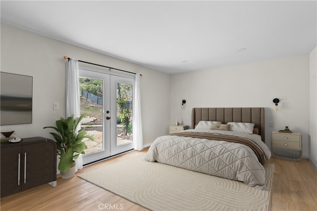 6 Santa Clara Drive Lompoc, CA 93436 - Photo 23 of 40 a bedroom with a large bed and a flat tv screen on a dresser