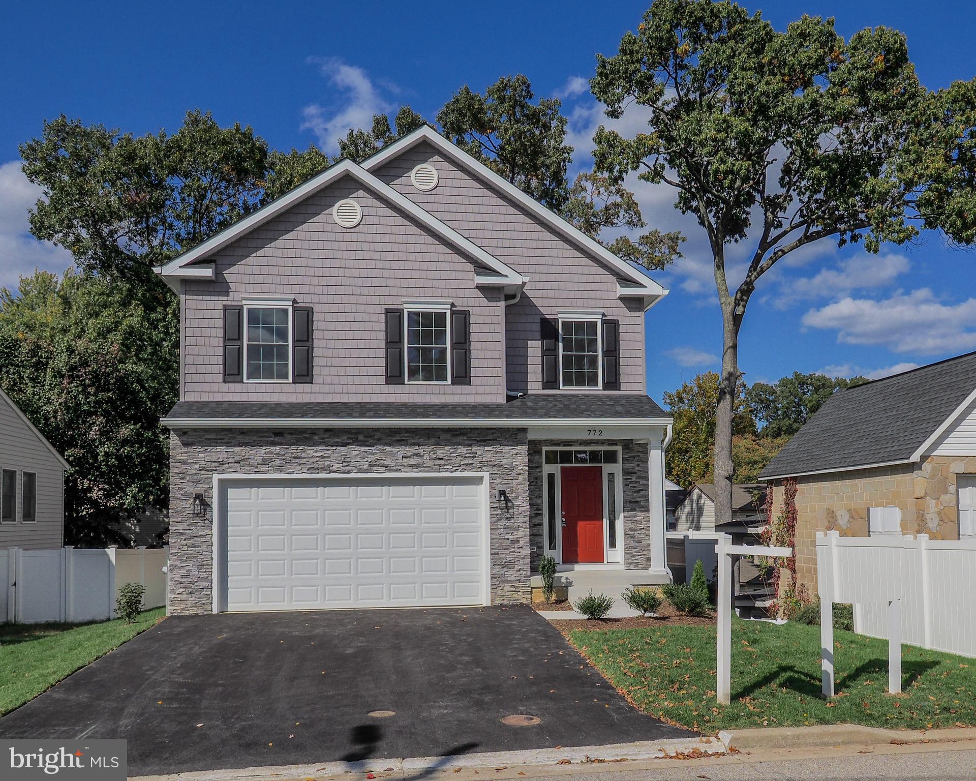 a front view of a house with yard