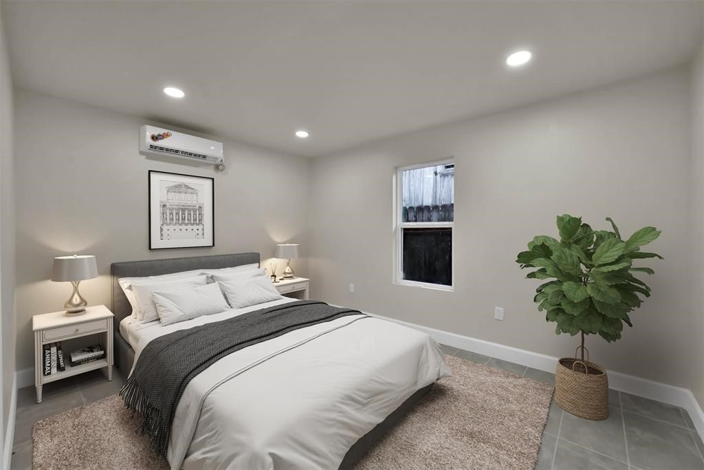 2304 Chapman Street, Unit 3 Houston, TX 77009 - Photo 10 of 17 a bedroom with a bed and a potted plant