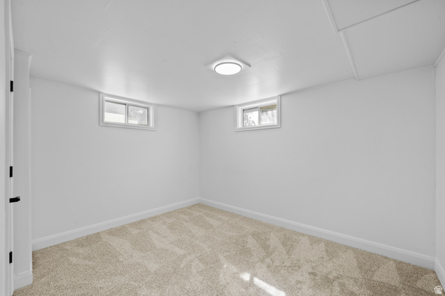 2267 West 4350th Street South Roy, UT 84067 - Photo 28 of 32 Below grade area featuring carpet floors and baseboards