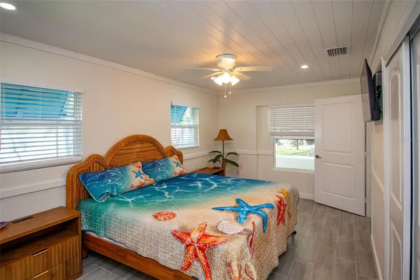 a bedroom with a bed and window