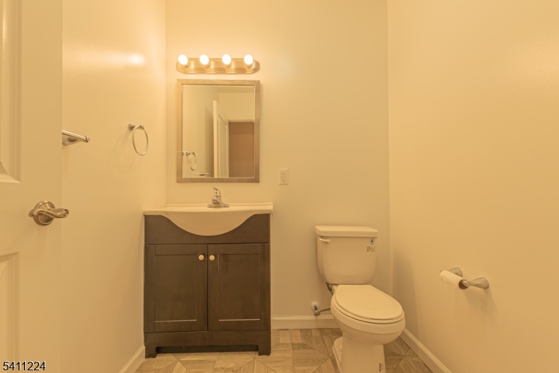 238 James Street Hackensack, NJ 07601 - Photo 4 of 24 a bathroom with a sink a toilet and shower