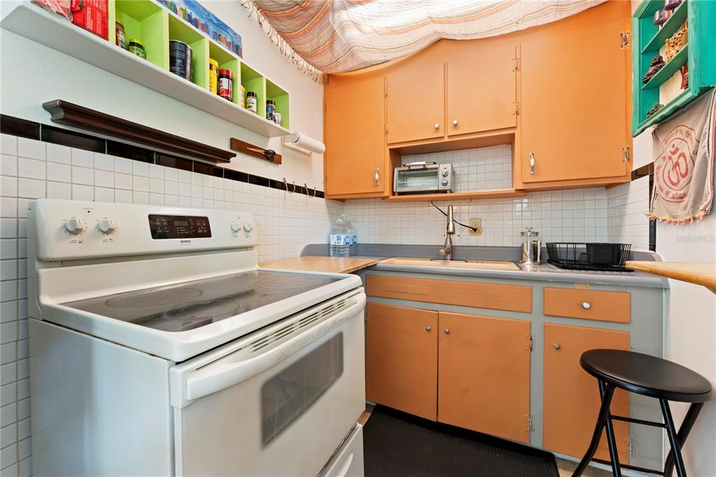 1335 40th Street Sarasota, FL 34234 - Photo 20 of 50 a kitchen that has a sink and a stove in it