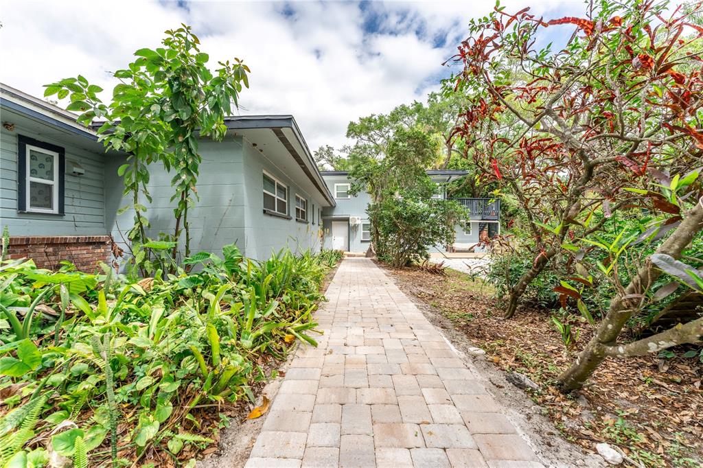 1335 40th Street Sarasota, FL 34234 - Photo 2 of 50 a house with a yard and potted plants