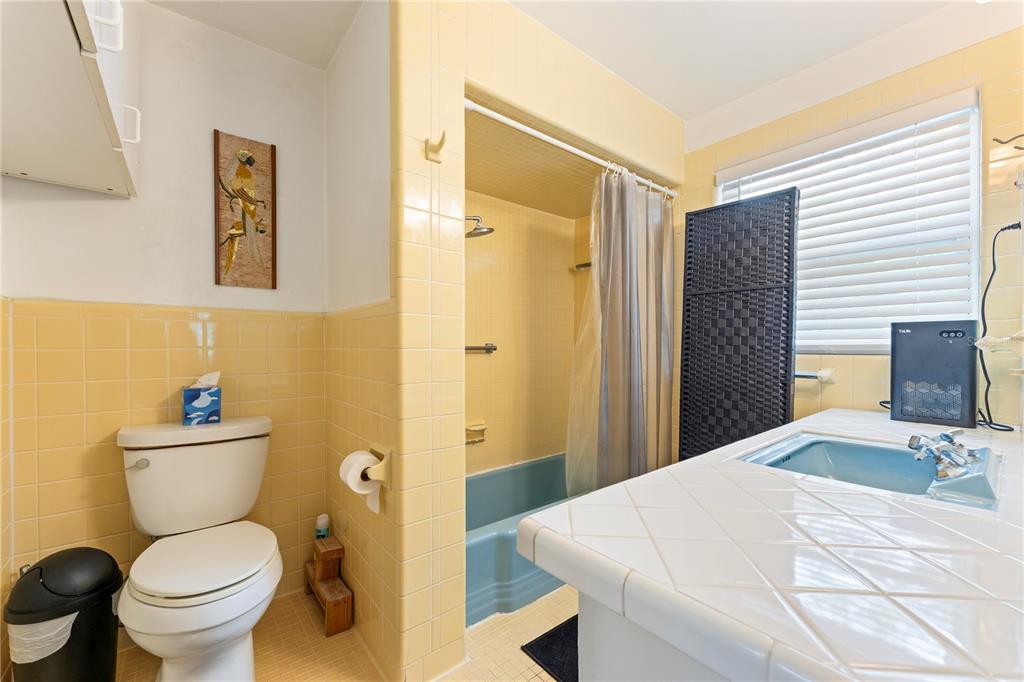 1335 40th Street Sarasota, FL 34234 - Photo 21 of 50 a bathroom with a sink toilet and shower