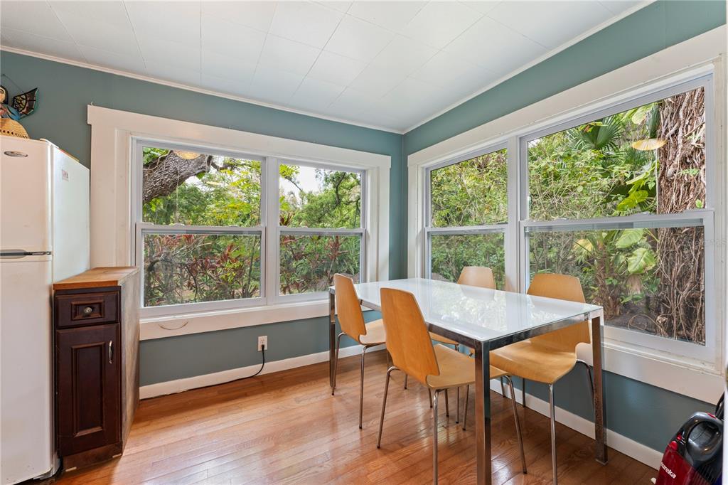 1335 40th Street Sarasota, FL 34234 - Photo 25 of 50 a view of a dining room with furniture window and wooden floor
