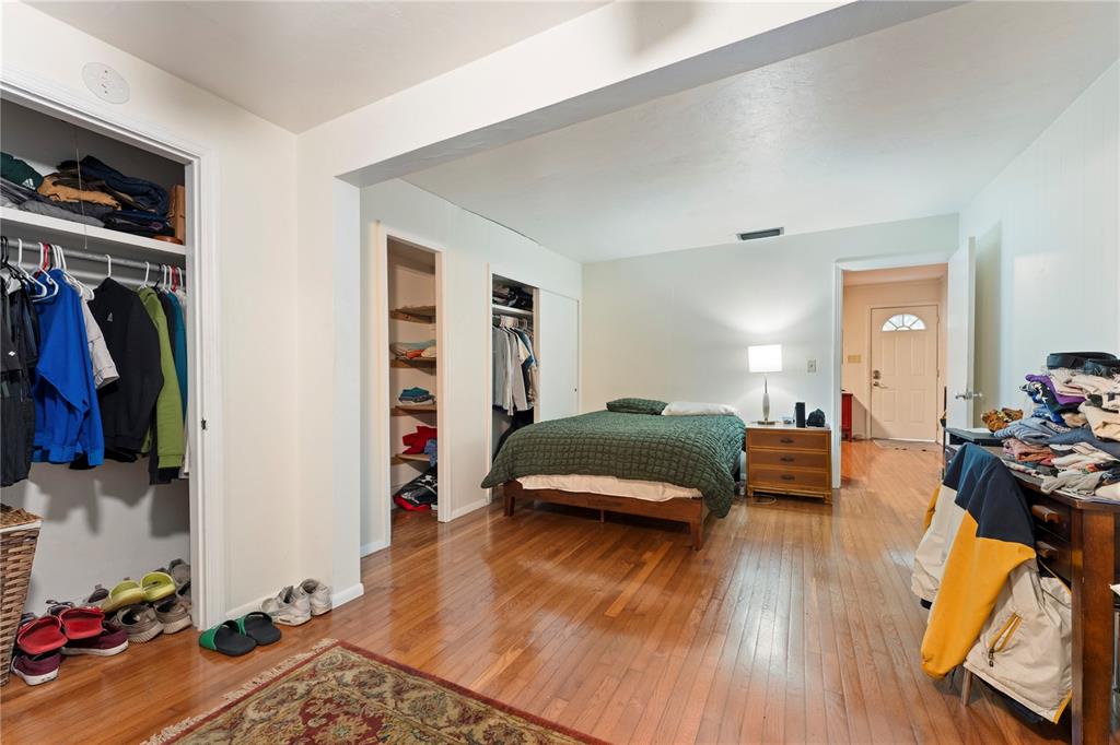 1335 40th Street Sarasota, FL 34234 - Photo 30 of 50 a bedroom with a bed and a wooden floor