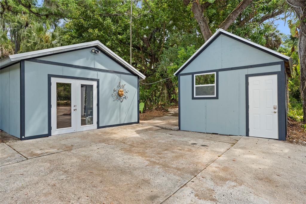 1335 40th Street Sarasota, FL 34234 - Photo 37 of 50 a view of a house with a yard and garage