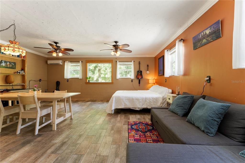 1335 40th Street Sarasota, FL 34234 - Photo 4 of 50 a bed room with a bed and a couch