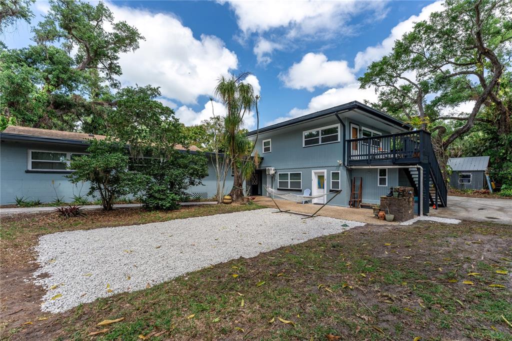 1335 40th Street Sarasota, FL 34234 - Photo 50 of 50 a front view of a house with a yard covered with snow and trees