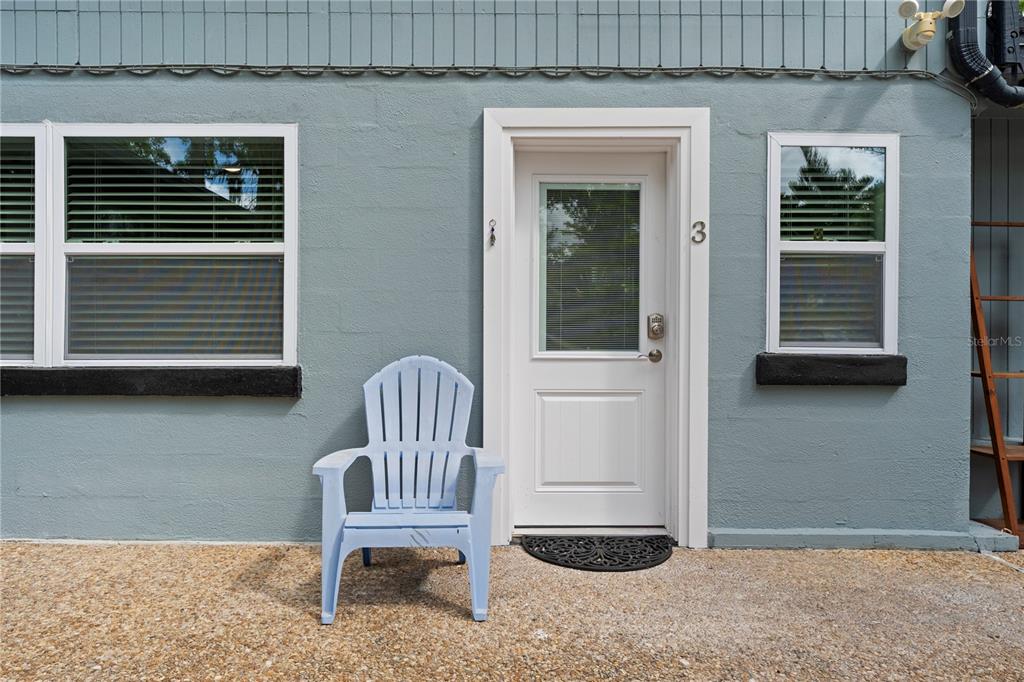 1335 40th Street Sarasota, FL 34234 - Photo 8 of 50 a chair and a table in a balcony