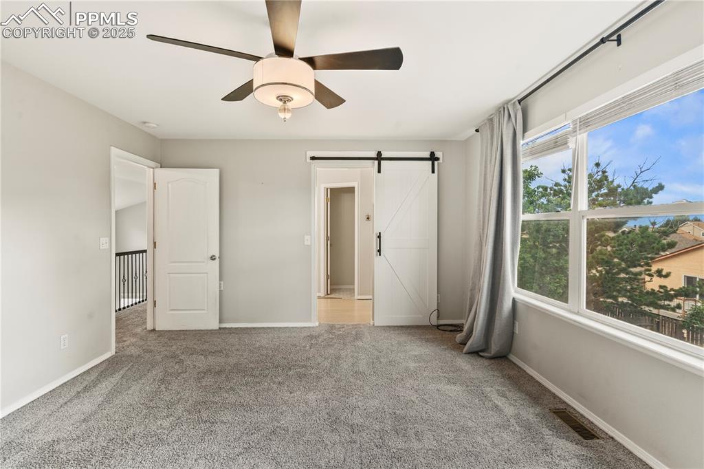 3320 Tail Spin Drive Colorado Springs, CO 80916 - Photo 14 of 28 a view of an empty room with a window