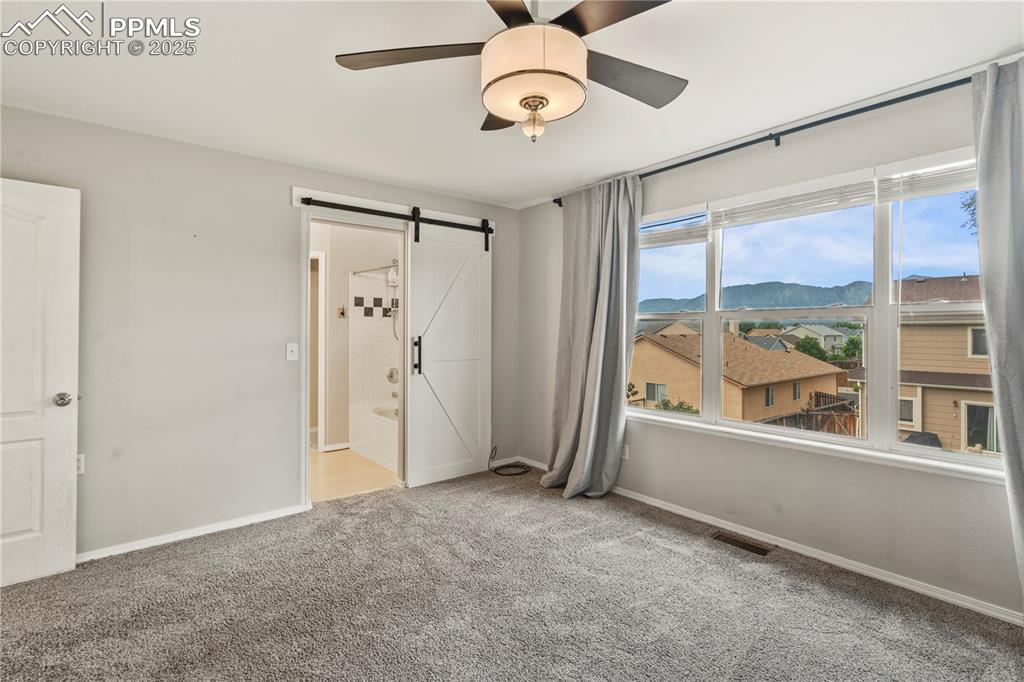 3320 Tail Spin Drive Colorado Springs, CO 80916 - Photo 15 of 28 a view of an empty room with a window