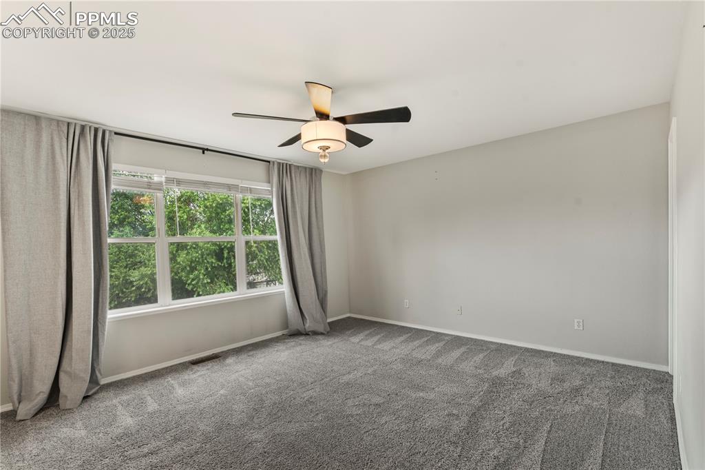 3320 Tail Spin Drive Colorado Springs, CO 80916 - Photo 16 of 28 a view of room window and a ceiling fan