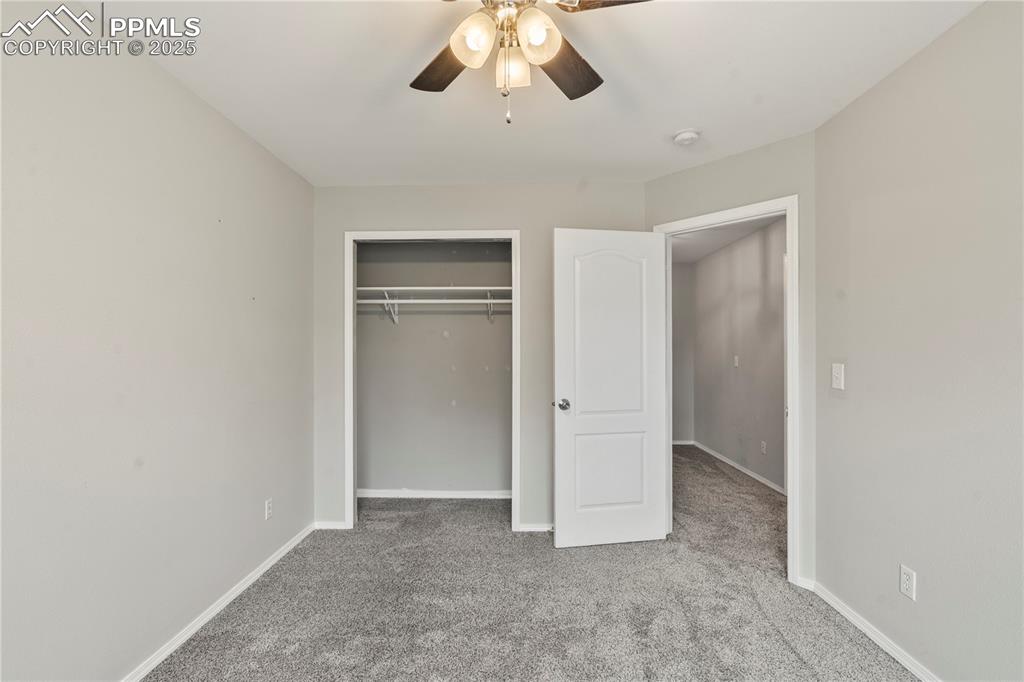 3320 Tail Spin Drive Colorado Springs, CO 80916 - Photo 21 of 28 an empty room with chandelier fan