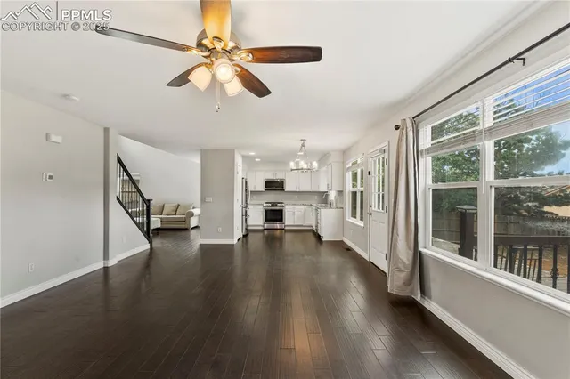 a view of an entryway with wooden floor